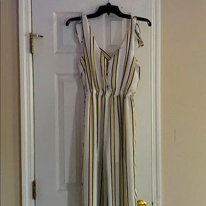 White jumpsuit with yellow and navy blue stripes
